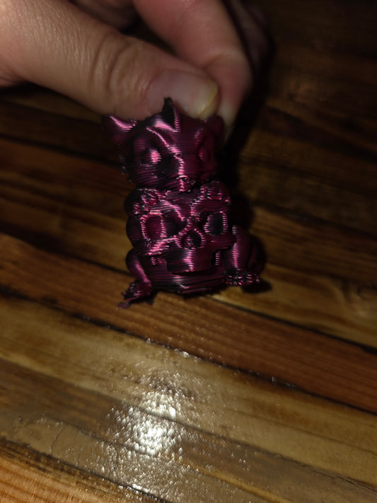 Small baby dragon with skull